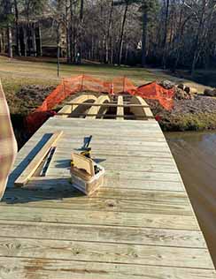 Photo of construction of wooden bridge.